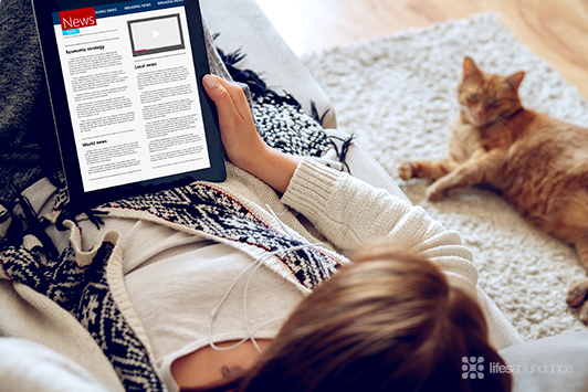 reading news on tablet